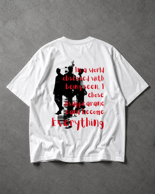 White t-shirt with black and red graphic design on a gray background
