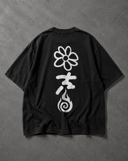 Black t-shirt with white floral and abstract designs on a gray background