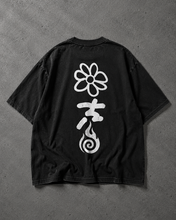 Black t-shirt with white floral and abstract designs on a gray background